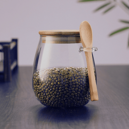 Pot hermétique en verre au design minimaliste avec couvercle en bambou pour une organisation élégante de la cuisine.